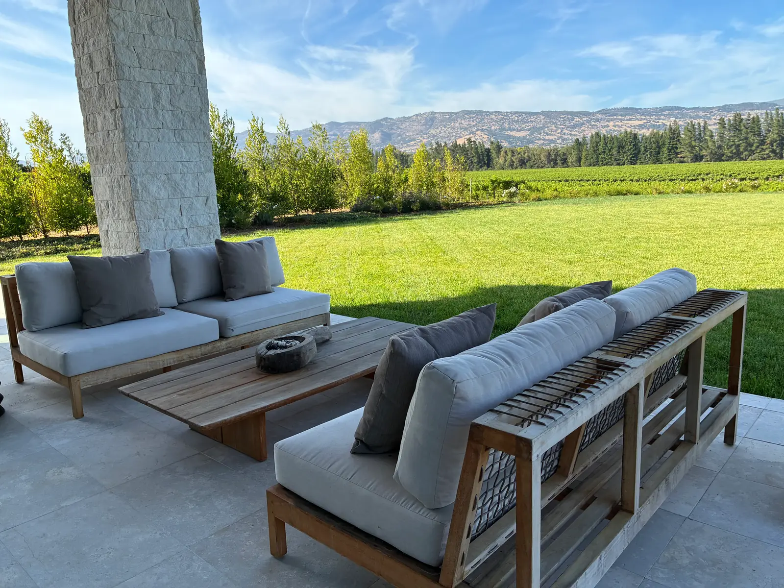Outdoor living space overlooking lawn and Napa Valley views
